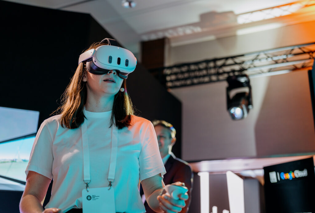 Liana O'Cleirigh using a VR headset to interact with an immersive digital twin, a key resource available at the event.