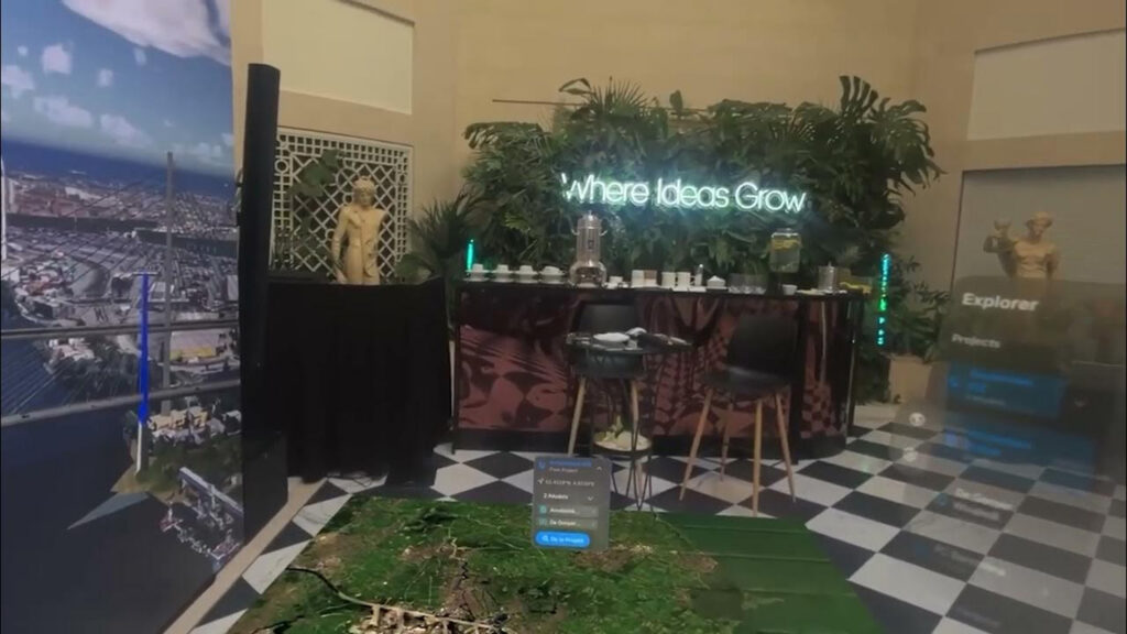 An innovation lounge space with a neon sign that reads "Where Ideas Grow" and interactive screens displaying 3D digital models.