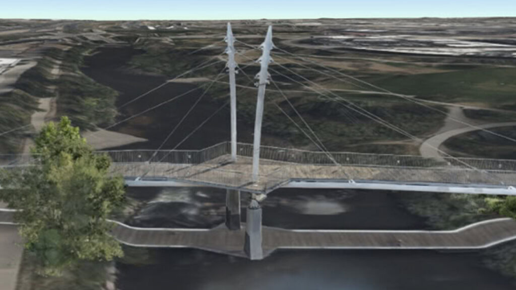 A digital twin of a construction site, showing the steel framework of a building with a location pin, demonstrating project progress monitoring.