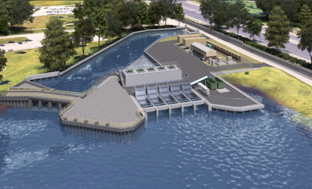 Aerial view of a water treatment facility with concrete channels, stairs, and walkways on a blue canal surface nearby green trees and roads