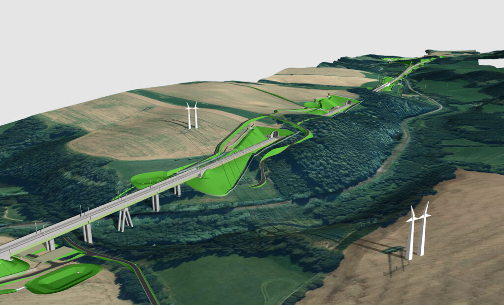 Aerial view of a hillside wind farm with tall turbines, winding roads, and green levees surrounding fields and forests.
