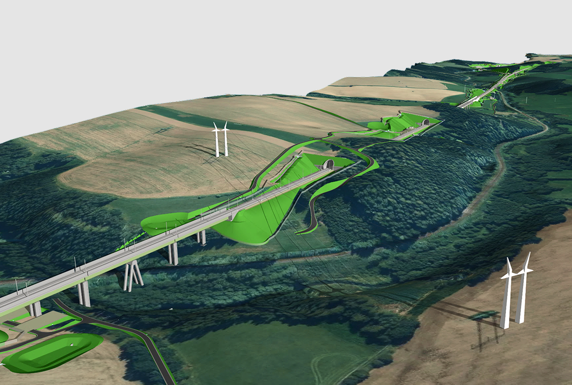Aerial view of a winding elevated bridge through green fields and hills, with wind turbines nearby.