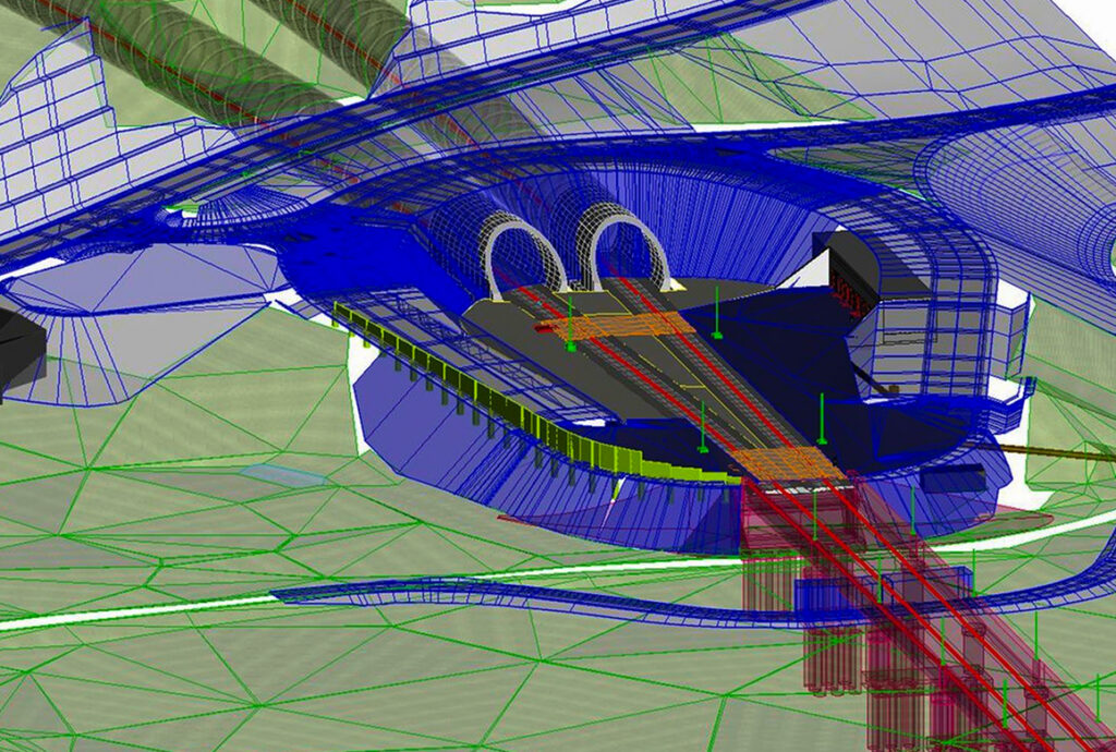 3D CAD rendering of a roller-coaster station with tunnels, red tracks and blue supports over a green terrain grid.