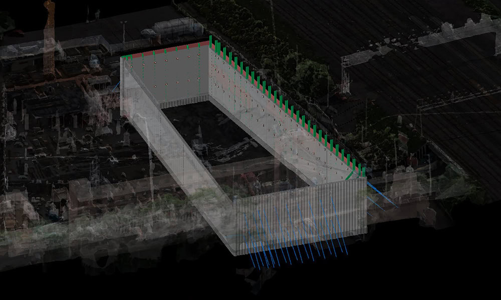 A digital rendering shows a rectangular construction site excavation with retaining walls, reinforcement rods, and structural supports highlighted in color.