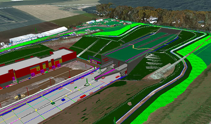 A digital 3D model of a construction site, showing buildings, roads, and terrain features overlaid with colored lines and shaded areas for planning and design.