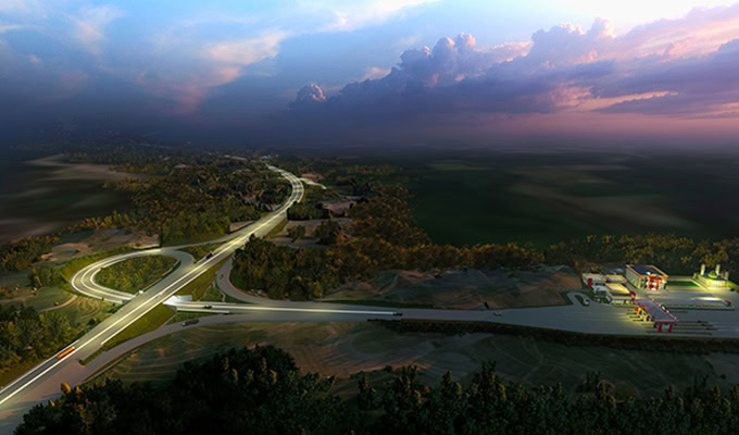 Aerial view of the Trans Sumatera Toll Road Serbelawan-Pematangsiantar interchange and rest area illuminated at dusk, surrounded by trees and open landscape under a cloudy sky.
