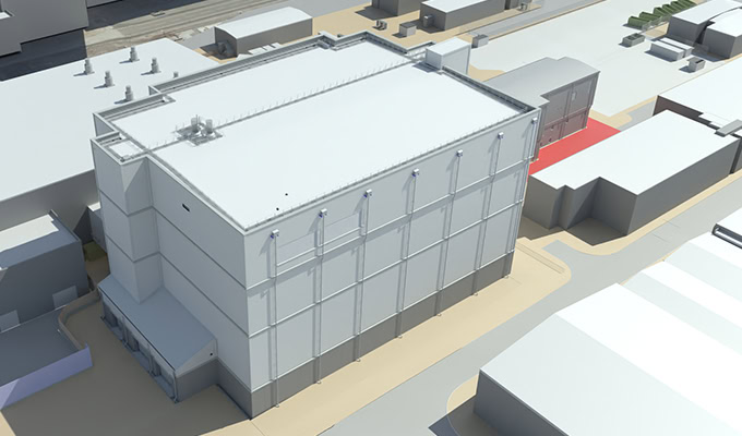 Aerial view of a large, rectangular industrial or commercial building—possibly the SPRS Retreatment Plant at Sellafield—surrounded by other smaller buildings and paved areas.