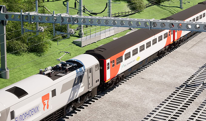 An electric passenger train labeled "EUROPHOENIX" travels on parallel tracks under overhead wires in a grassy, fenced area, showcasing the impact of Midland Main Line Electrification.