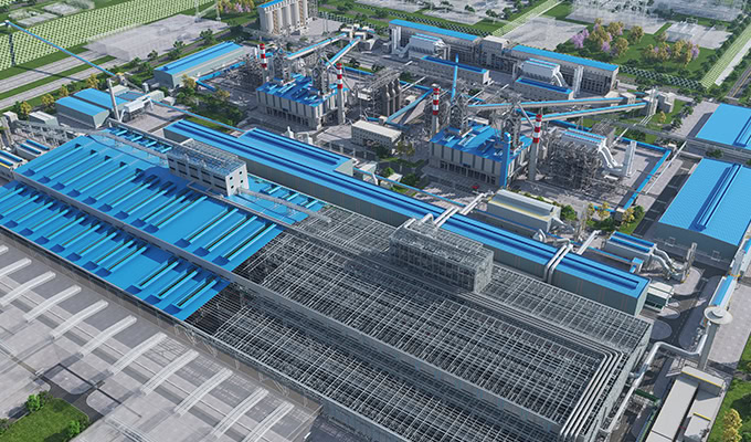 Aerial view of a large industrial complex with multiple blue-roofed buildings, warehouses, and adjacent infrastructure in a green, landscaped area.