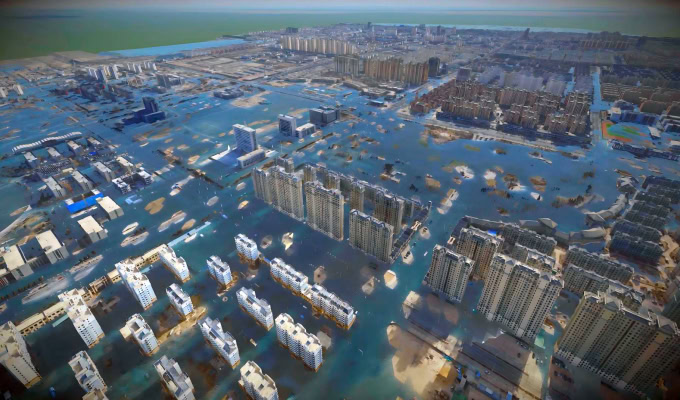 Aerial view of a city in Northwest China with many high-rise buildings and streets submerged in floodwater, highlighting challenges in urban flood control as the inundation extends toward the coastline in the background.