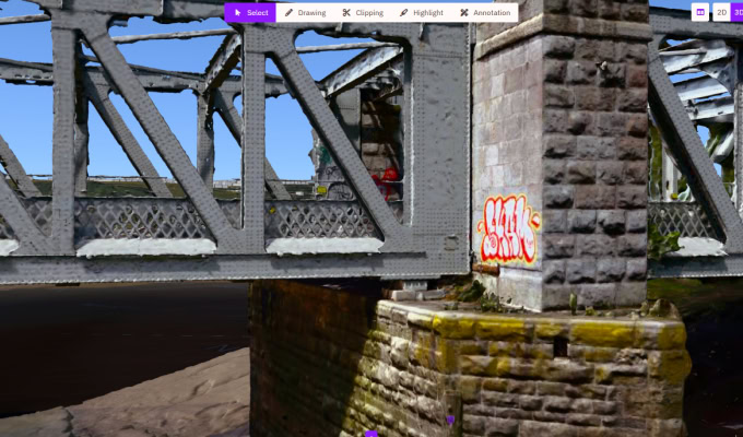 A close-up view of a metal and stone bridge over water at Bristol Harbour, with graffiti on a stone pillar and digital annotation tools from an Asset Condition Survey visible at the top of the image.