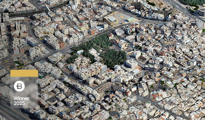 Aerial view of a densely built urban area with a patch of greenery in the center, highlighting China Southern Power Grid’s GIS+BIM digital intelligence; badge overlay reads “B Winner 2025.”.